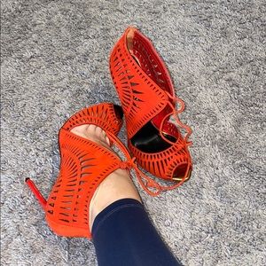 Tom Ford cut out pep toe heels in red suede